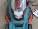a lawn mower that is sitting on the ground