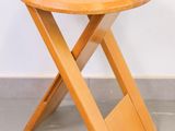 an image of a small wooden table with a wooden cross legs