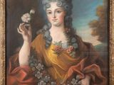 tableau représentant une femme tenant une fleur dans sa main droite et un oiseau dans l'autre main