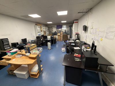 a room with a lot of desks and computers in it