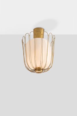an image of a light fixture with a glass shade hanging from it ' s ceiling