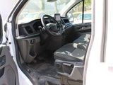 a white van with the door open and the driver ' s seat down