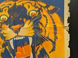 a large poster of a tiger on the wall