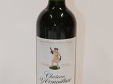 a bottle of wine that is sitting on a table