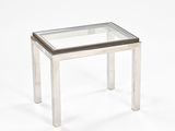rectangular glass coffee table with metal legs and a glass top