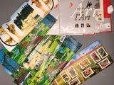 a lot of postcards that are laying on a table