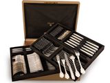 a box with silverware in it on a white background