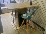 a desk with a chair and a computer on it