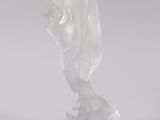 statue of a woman with a veil on her head on a white surface
