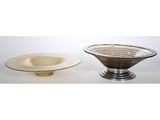 a pair of glass bowls and a plate on a stand