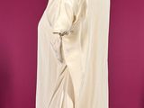 an image of a white shirt on a mannequin stand