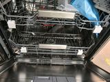 an image of a dishwasher with the door open