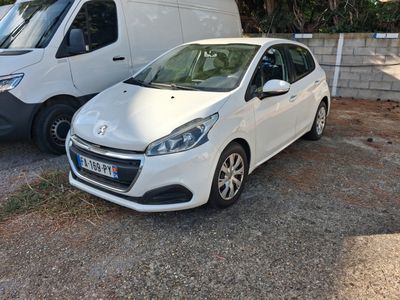 two white cars parked next to each other in a parking lot