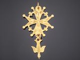 a gold cross on a black background