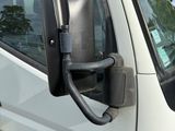 a white van with a mirror on the side of it