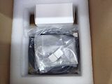 a box with a white electronic device inside of it