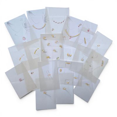 a pile of white cards with different designs on them