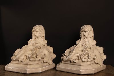 pair of white marble figurines of a woman and a man