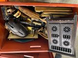 a red cabinet with a lot of assorted items in it