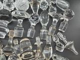 a lot of glass bottles that are sitting on a table