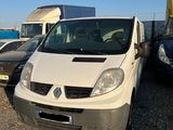 a white van that is parked next to other cars