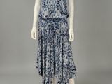 a mannequin wearing a blue and white dress with a floral pattern