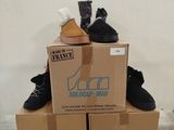 two boxes with shoes on top of them on a pallet