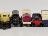 a lot of toy trains that are lined up on the table