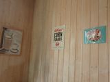 two signs on the wall of a room that says corn flakes