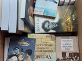 many books in a box on the table