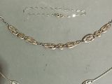 three different types of necklaces and bracelets on a table