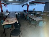many tables and chairs in a room that is empty