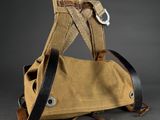 an image of a brown bag with a black strap