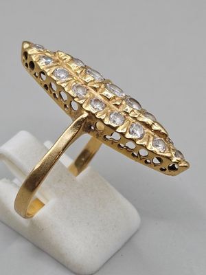 a close up of a gold ring with diamonds on it