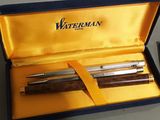 two pens in a box that are sitting on a table