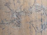 a close up of a wooden table with a clock on it