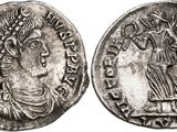 une pièce d'argent portant l'image d'une femme et d'un homme