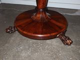 a wooden table with a vase on top of it
