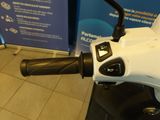 a close up of a motorcycle handle on a tiled floor