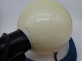 someone is using a blow dryer to dry a white object