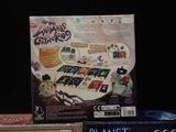 a box with a board game on it and a box with a card game on it