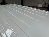 an image of a white car in a garage