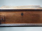 an old wooden chest sitting on top of a table