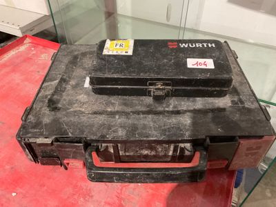 a black case sitting on top of a red table