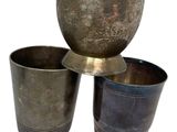 three cups sitting next to each other on a white surface