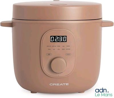 a brown rice cooker with a digital clock on top of it