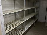 a room with a bunch of shelves in it