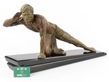 statue of a man doing a yoga pose on a black base
