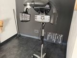 a hair dryer sitting on a stand in the corner of a room