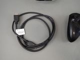 a close up of a video game controller and a charger